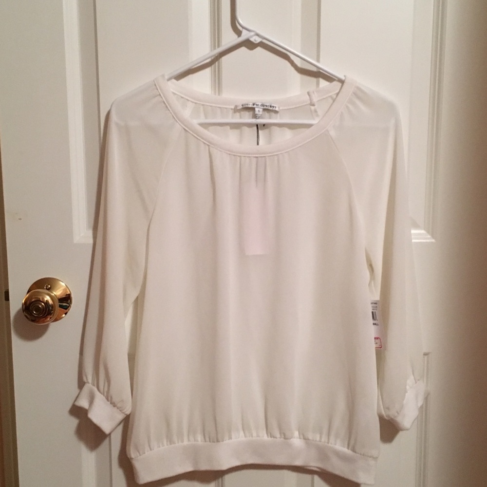 White Silk like 3/4 length sleeve shirt.
